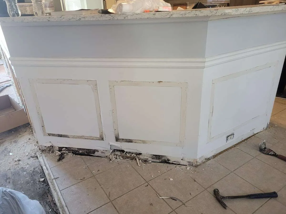 Water damage and mold on kitchen during Storm Damage Restoration in Falmouth